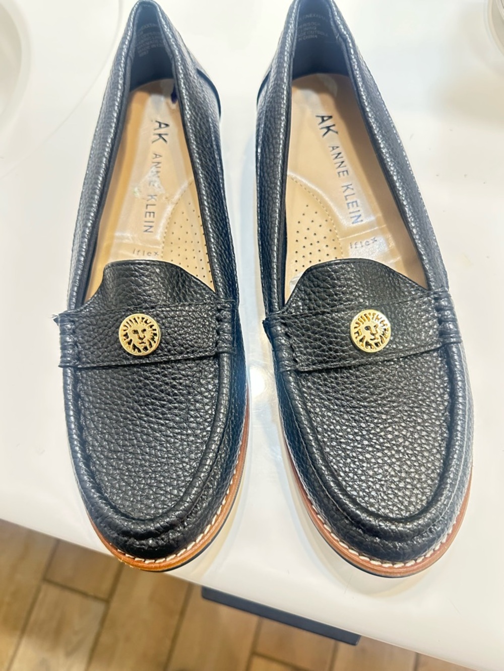 Anne Klein Black Pebbled Leather Penny Loafers with Gold Medallion